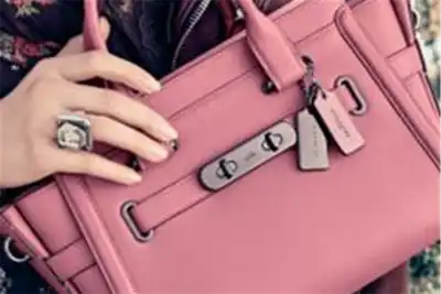 Ambitious Coach touted as Jimmy Choo suitor