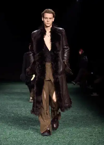Leather trenches and long boots line up at Burberry